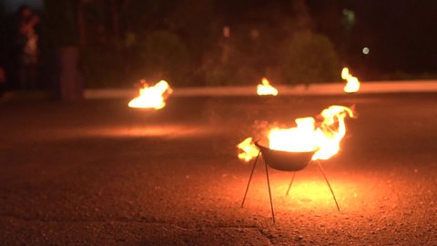 The fire burns in the props intended for the fire show. Demonstration start with fire, background, copy space for text, slow motion