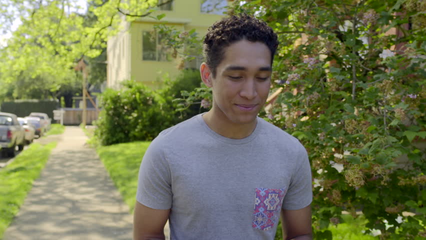 Young Man, Daydreams, Walks Around Neighborhood, Smiling (Slow Motion)