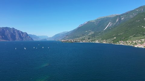 Aerial view of the trimelone island at Lake Garda Italy. Small island on the water. Islet on the lake in the background of the Alps.