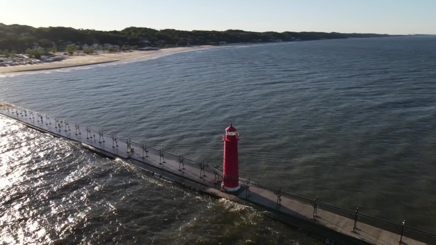 Grand Haven, Michigan lighthouse with a wide circle view. Royalty-Free Stock Footage #1061498473
