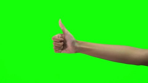 close-up hand of asian man slowly showing thumb up sign gesture isolated on chroma key green screen background.