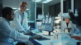 Female Research Scientist Has a Conversation with Bioengineer About the Effects of Different Pharmaceutical Drugs on Brain. They Look at Computer Software Visualization in a Modern Science Laboratory. - Powered by Shutterstock - Get 15% off with code: PIKWIZARD15