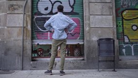 Young man with mask closing the door of a store business during the coronavirus crisis. Crisis for the local business due to covid economic recession. - Powered by Shutterstock - Get 15% off with code: PIKWIZARD15