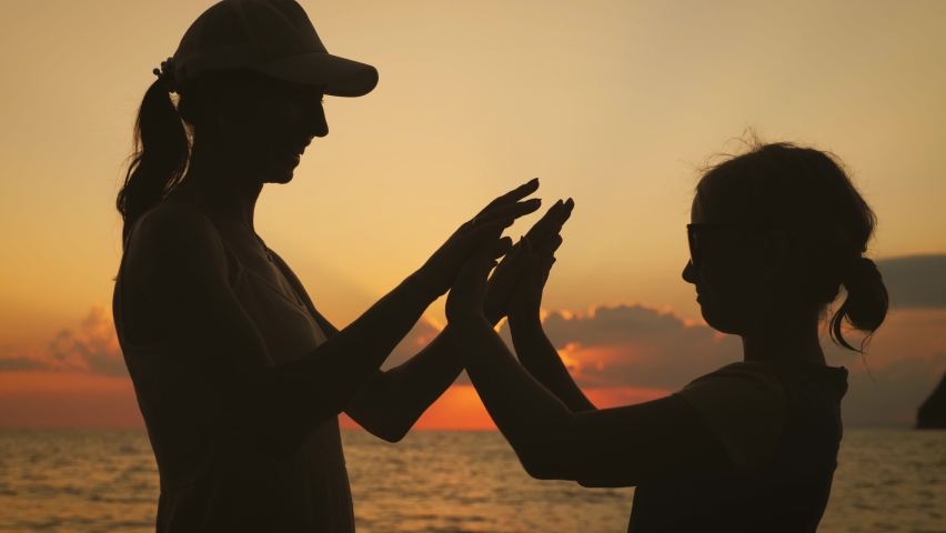 Happy family mother and daughter on vacation at the beach.