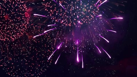 Beautiful colourful Fireworks Shiny Display at Night Loop Background. For 4th of July, festival, Anniversary, Celebration, Party, New Year, Happy Birthday, Wedding, Confetti, Diwali, Christmas.