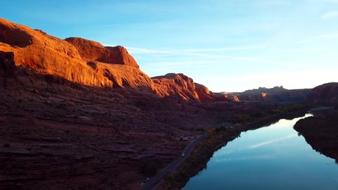 Southwest Desert Road during Sunset with Scenic River in Moab, Utah. Aerial Drone Establishing View