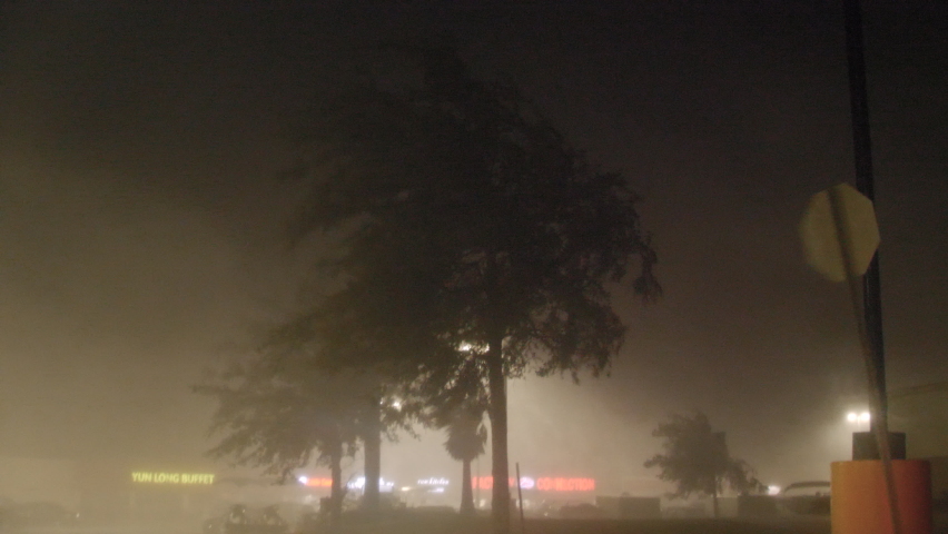 Waveland, MS / USA - October 28, 2020: Hurricane Zeta Powerful Winds Rip through Shopping Plaza As Power Flickers