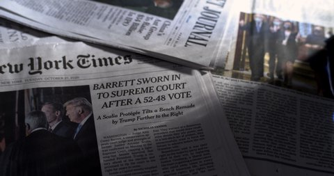 New York, New York United States - October 23 2020: Newspaper coverage of the swearing in ceremony of new Supreme Court Justice Amy Coney Barrett. Wall Street Journal, NY Times.