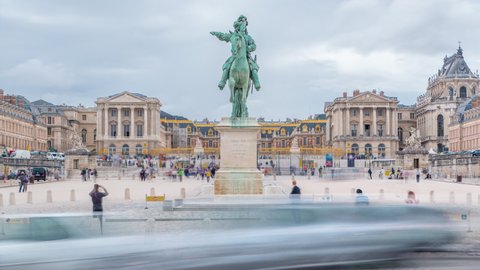 Parade ground of the castle of Versailles with the equestrian statue of Louis XIV timelapse. Traffic on road and tourists walking around. Cloudy sky at summer day