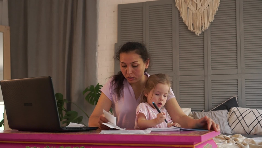 The family financial crisis, business problems during Covid-19. Worried mother with child. Coronavirus, Quarantine, Social Distancing, Self-Isolation, Lockdown, Stay at home, Remote working | Shutterstock HD Video #1061557798