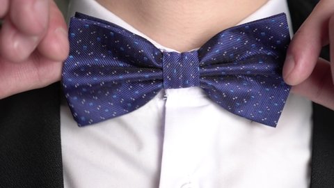 Bow tie close up. Man wears a bow tie around his neck. Classic men's fashion.
