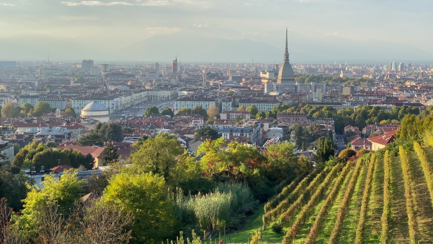 Panoramic view of Turin at sunset, with Mole Antonelliana, Vittorio's Square, and the Queen's vineyard at the forefront. Royalty-Free Stock Footage #1061569084