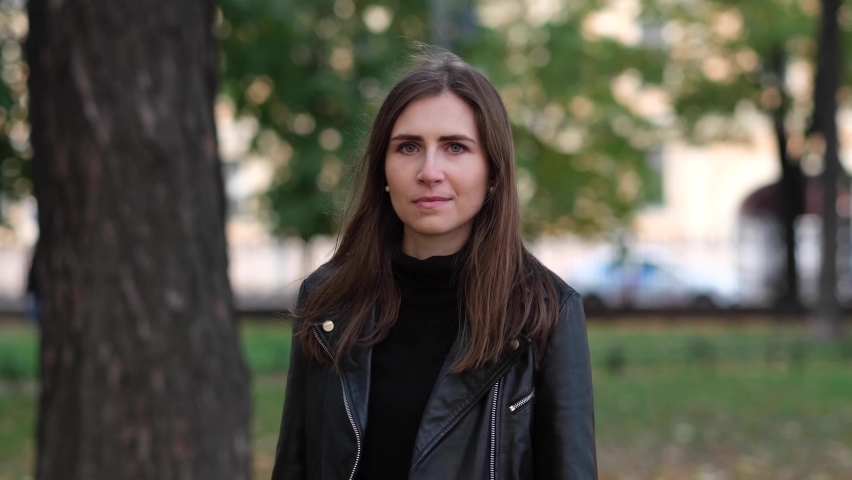 Beautiful woman walking in the autumn park