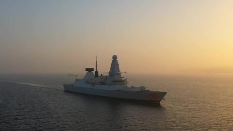 ISTANBUL - CIRCA 2020: Warship underway in mist in the morning. Royal Navy Type 45 daring class destroyer HMS Dragon is part of the most powerful destroyer class ever built in the UK
