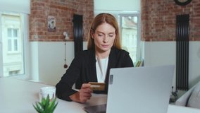 Beautiful woman shopping online with credit card use laptop waiting for approve payment at home. Vlogger influencer around social media, app icons animation loud with blue interface. Slow motion - Powered by Shutterstock - Get 15% off with code: PIKWIZARD15