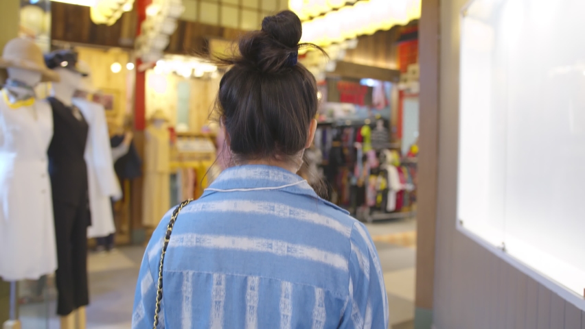 attractive asian female wearing facial mask corona virus protective new normal lifestyle walking shopping in malls supermarket background