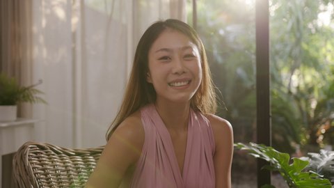Portrait headshot of young single attractive asian female smile looking at camera at home feeling happy confident in beauty blogger vlogger micro influencer with self mental healthy concept.