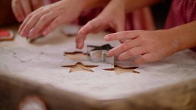Close Up Of The Caucasian Hands Of Children Daughter Making A Gingerbread Cookie In The Form Of A Star And Christmas Tree. Family Spending Time Together At Home. Christmas And New Year Concept Slow Mo - Powered by Shutterstock - Get 15% off with code: PIKWIZARD15