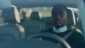 Attractive concentrated young african american man driving luxurious car fast through the city on business trip. Destination. Commuting. Private car transportation. - Powered by Shutterstock - Get 15% off with code: PIKWIZARD15