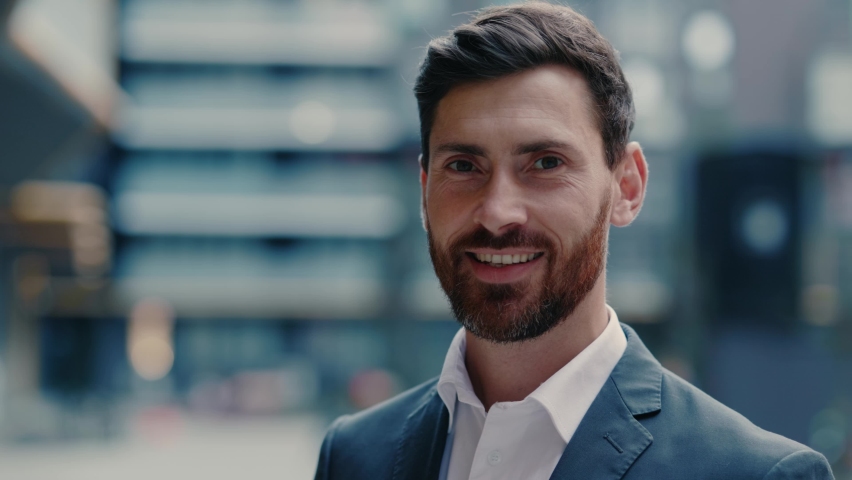 Face of handsome positive businessman corporate leader boss executive successful employer smiling at camera outdoors. Businessperson portrait. Entrepreneur. Expressions. Royalty-Free Stock Footage #1061608927