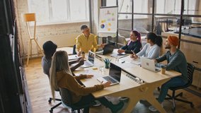 Brainstorming meeting. Creative team discussing new ideas in coworking space, tracking shot - Powered by Shutterstock - Get 15% off with code: PIKWIZARD15