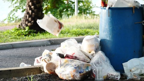Slow motion of People throwing Food and Drink garbage outside the trash. Environmental Issues, Social Issues, carelessly