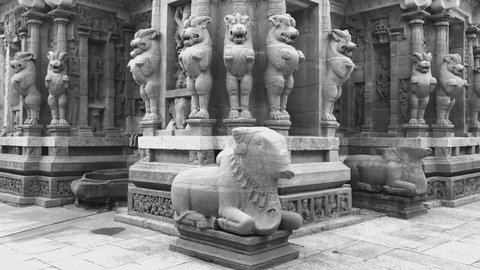 Exterior view of tower of ancient historic Kanchi Kailasanathar temple with sandstone carvings of Bull, Lion sculptures on the pillars of the temple in Kanchipuram, Tamilnadu, India.