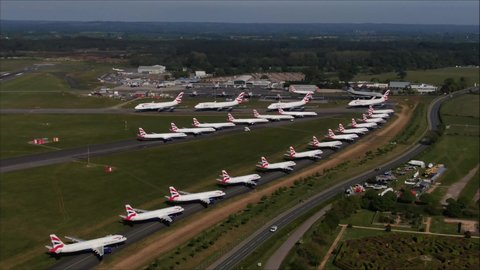 Bournemouth / United Kingdom (UK) - 05 05 2020: Aerial drone shot of Planes parked up on taxiway at Bournemouth Airport because of COVID-19 lockdown. British Airways Aircraft Travel ban and job cuts c