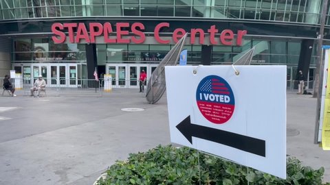 Voters wait in line to cast their ballots in a vote center at Staples Center in Los Angeles, Sunday Nov. 1, 2020.