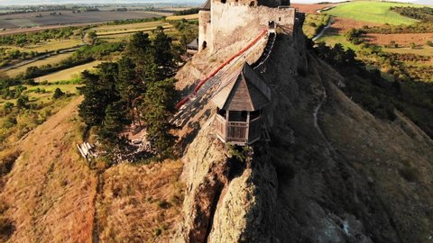 Aerial View of Ancient Boldogko Castle, 13th Century Historic Hungarian Landmark Watchtower and Surrounding Landscape on Sunny Summer Evening, Drone Shot