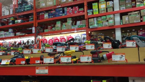 COQUITLAM , British Columbia / Canada - 11 02 2015: Coquitlam, BC, Canada - November 02, 2015 : One side of display electric saws at Home Depot store with 4k resolution