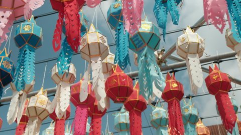 Colorful lanterns Lanna style during Loy Krathong festival in northern of Thailand on blue sky background. 