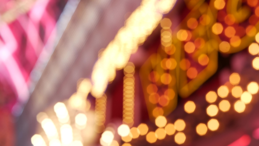Defocused old fasioned electric lamps glowing at night. Abstract close up of blurred retro casino decoration shimmering, Las Vegas USA. Illuminated vintage style bulbs glittering on Freemont street. | Shutterstock HD Video #1061647051