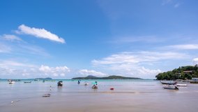 Beautiful blue sky white clouds over sea with Thai Longtail fisherman boats at rawai beach Phuket Thailand Time lapse video