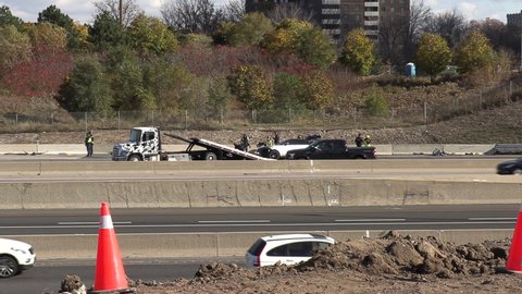 Toronto, Ontario, Canada November 2020 Tow trucks and police at car accident scene on Toronto highway