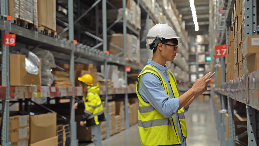 Asian Managers and supervisors working in a warehouse, controlling stock. Distribution storage area about logistics and organization. Royalty-Free Stock Footage #1061662204