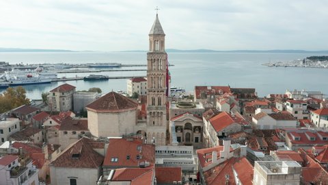 flying clockwise around iconic bell tower of old town Split Croatia 
