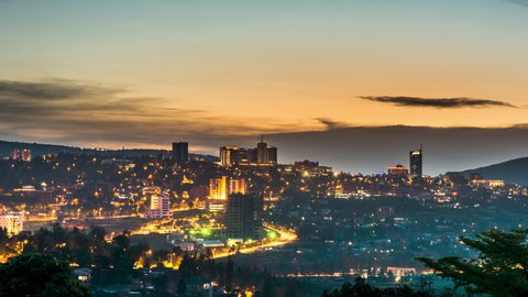 Timelapse video of Kigali city centre skyline and surrounding areas showing a darkening sky at night, Rwanda