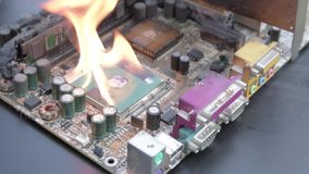 Computer motherboard ,circuit board is on fire to burn,flame. short circuit, burns computer chip - Powered by Shutterstock - Get 15% off with code: PIKWIZARD15