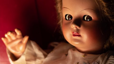 Scary vintage doll that rotates her eyes in half-light.