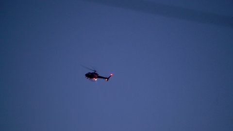 911 Police chopper searching for suspect at twilight in Los Angeles