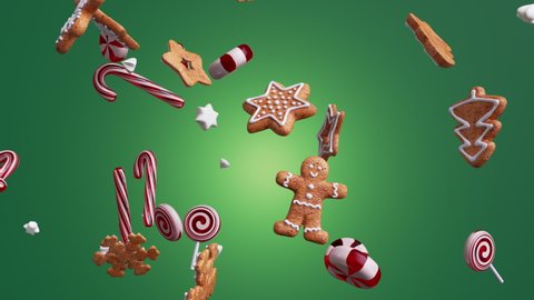 3d holiday animation with Christmas ornaments balls cookies candies biscuits fall spin and rotate, isolated on green background.