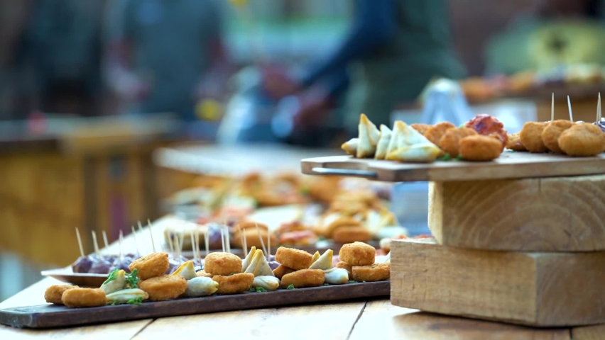 Focus rack of food platters served at a fancy event with a nice atmosphere