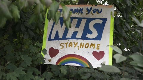 Handmade thank you to NHS and stay at home sign zoom in shot