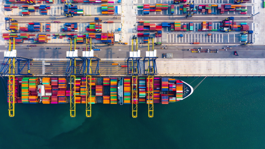4k footage aerial view timelapse container ship carrying container in import export business logistic and transportation of international by container cargo freight ship at industrial port