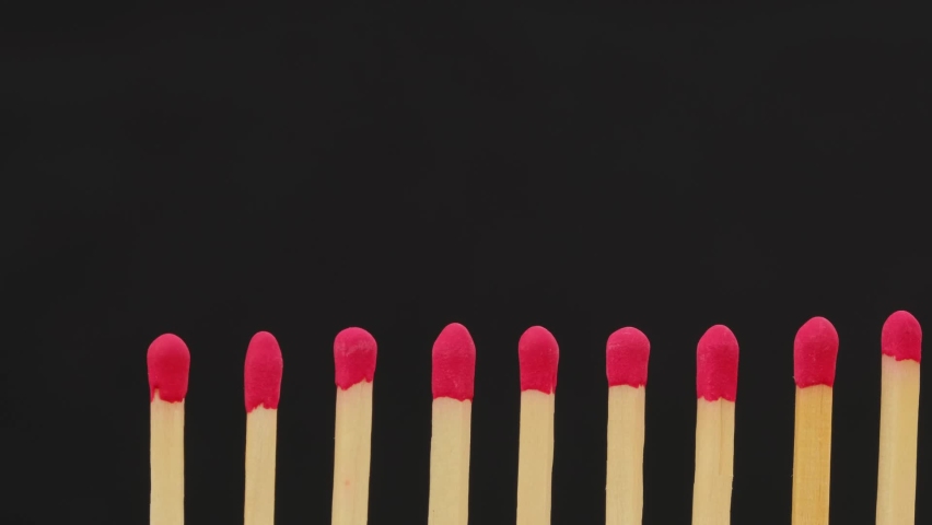 Burning matches against black. Stop epidemic. Domino effect. Social distancing concept footage. The spread of epidemics.  | Shutterstock HD Video #1061703028
