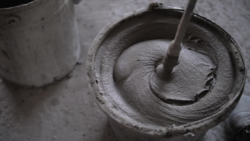 footage of mixing concrete mortar Royalty-Free Stock Footage #1061708944