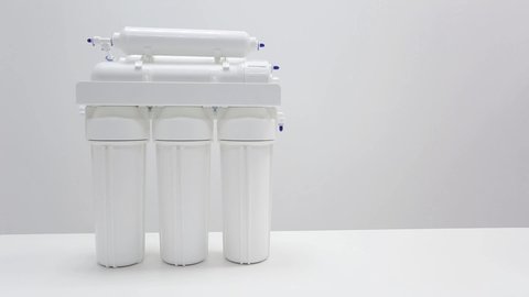 Alternate appearance of components for household reverse osmosis system with cylinders, tank, tap, membranes, professional water cleaning devices 