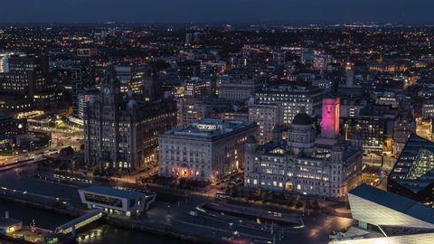 Establishing Aerial View of Liverpool UK, at night evening, evening lights, City Waterfront, United Kingdom