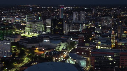 Aerial View Shot of Birmingham UK, United Kingdom, city at night evening dusk